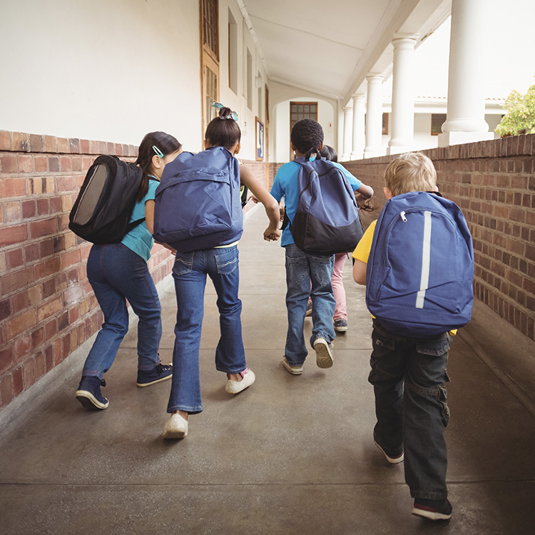 kids walking in outdoor sidewalk